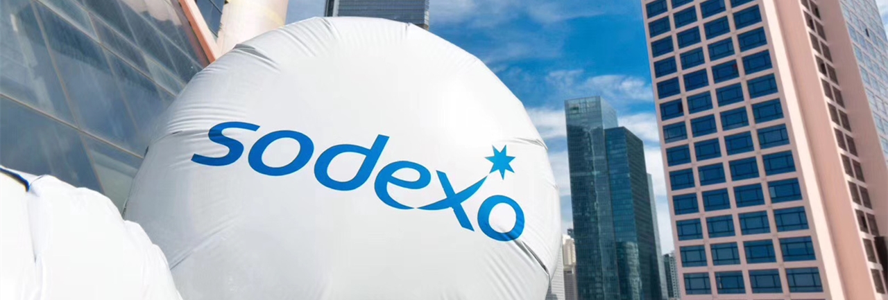 Man pointing at post-its on a clear board