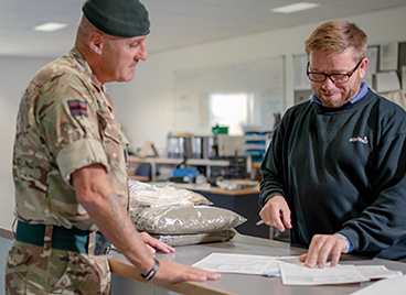 Sodexo employee speaking with military customer