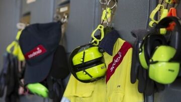 high visibility vest with sodeoxo logo, ear protection and safety goggles