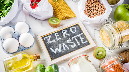 zero waste written on chalk board surrounded by food ingridients
